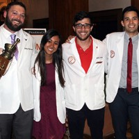 picture of group of pharm d students wearing white coats