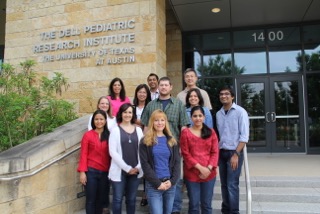 Vasquez Lab group photo standing in front of building