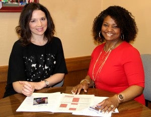 Dr. Jamie Barner and student seated at table