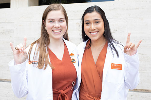 Two Pharmacy students at White Coat Ceremony