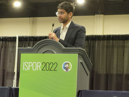 Student presenting at ISPOR 2022 podium