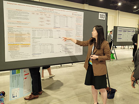 Student presenting poster at ISPOR 2022