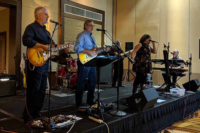 Dr. John DiGiovanni and band playing at event