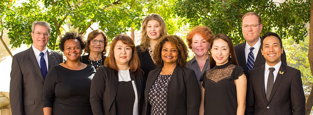 Health Outcomes Division faculty standing in outdoor setting