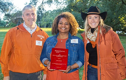 Dr. Jamie barner receiving alumni award at Pharmacy Homecoming Tailgate event