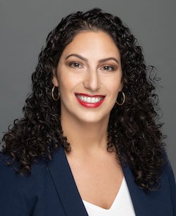 Dr. Tonia Guida smiling while wearing a blazer.