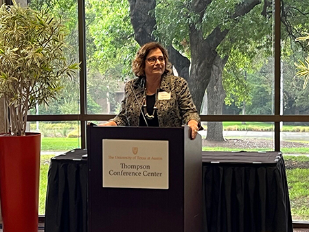 Dr. Karen Rascati speaking at podium at retirement event
