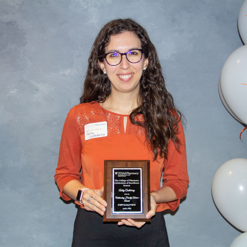 Dr. Ashley Castleberry with her award plaque.