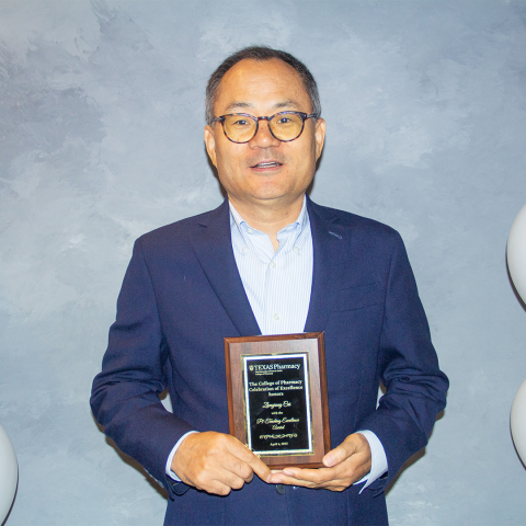 Dr. Cui with his award plaque.