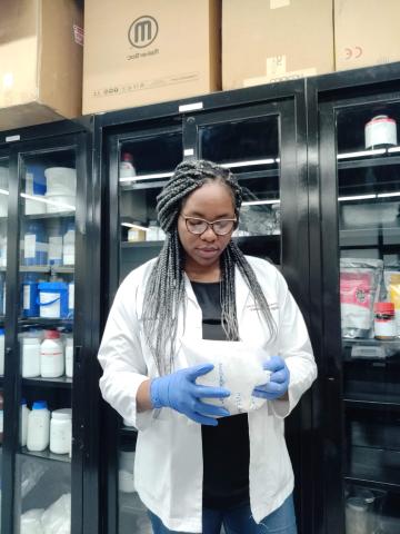 Student pharmacist Amaka Epoh working in the lab.