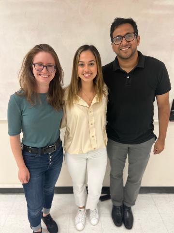 Student participants standing with leaders.