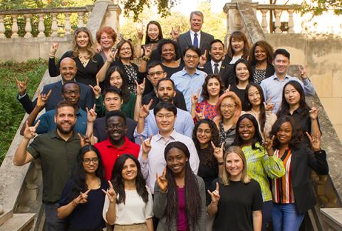 Group photo of Health Outcomes division faculty and students on outdoor staircase