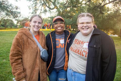 Student pharmacist Hannah McCullough standing with classmates at the Homecoming Tailgate 2022.