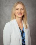 Dr. Kristy Schwarz smiling in headshot photo