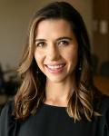 Dr. Erin Ohman smiling and wearing a black shirt