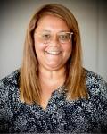 Dr. Sherra Gardner smiling and wearing a patterned blouse