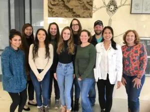 Dr. Andrea Gore and lab members standing in a group