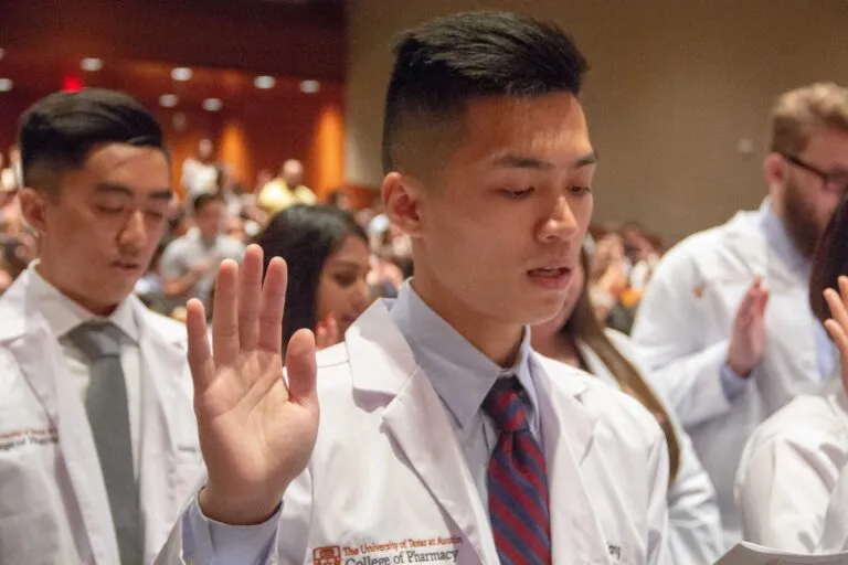 white coat ceremony hands