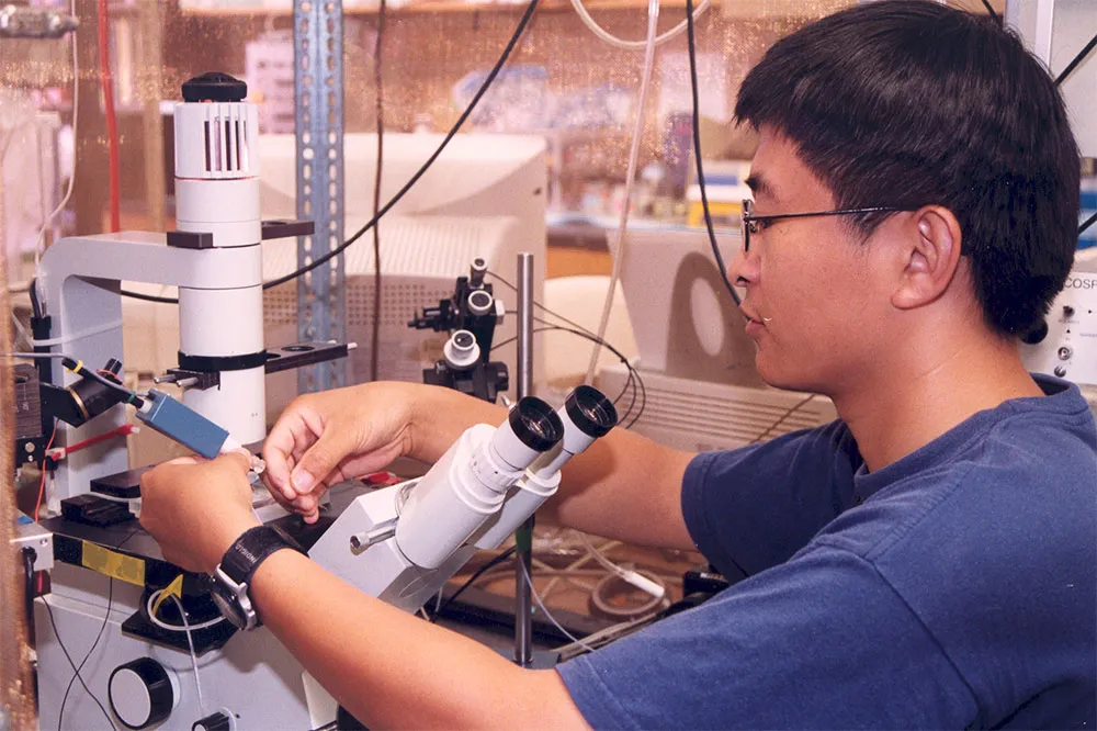 Researcher working with lab equipment