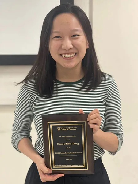 Hanxi Zhang receiving TxCORE student award