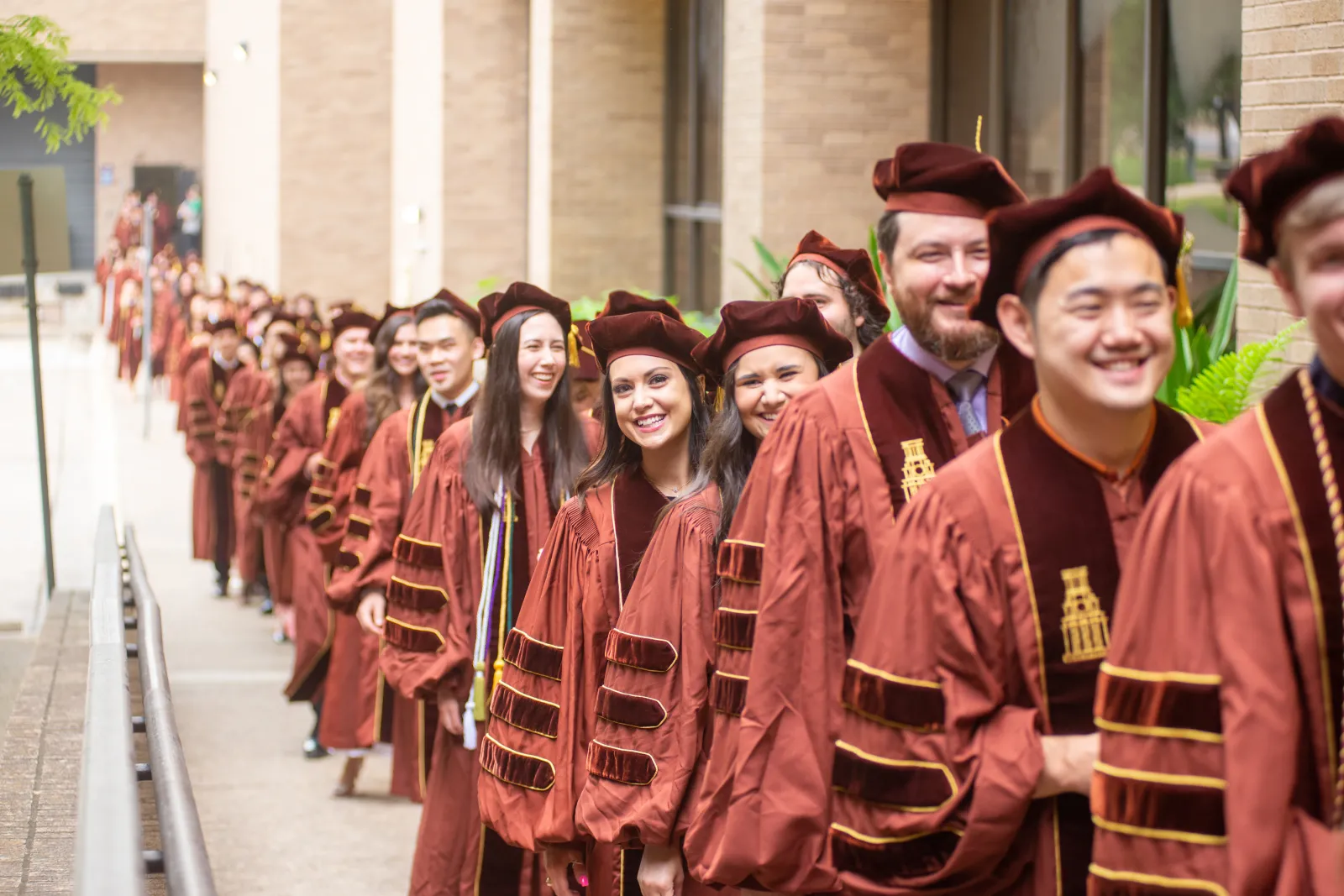 College of Pharmacy graduates in line at commencement.