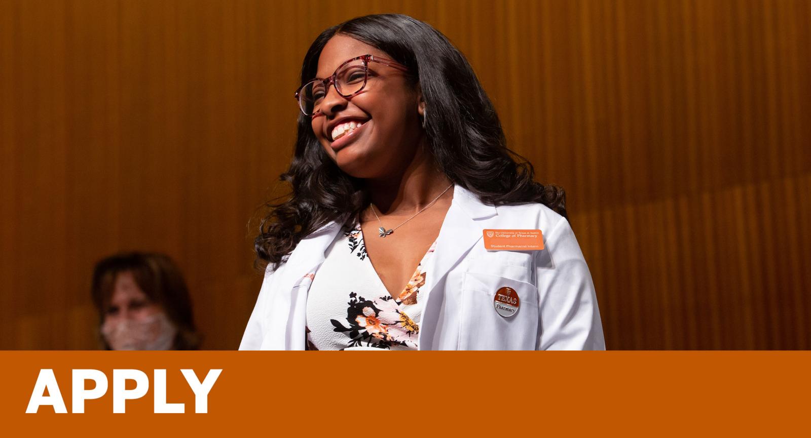 Smiling pharmacy student at white coat ceremony