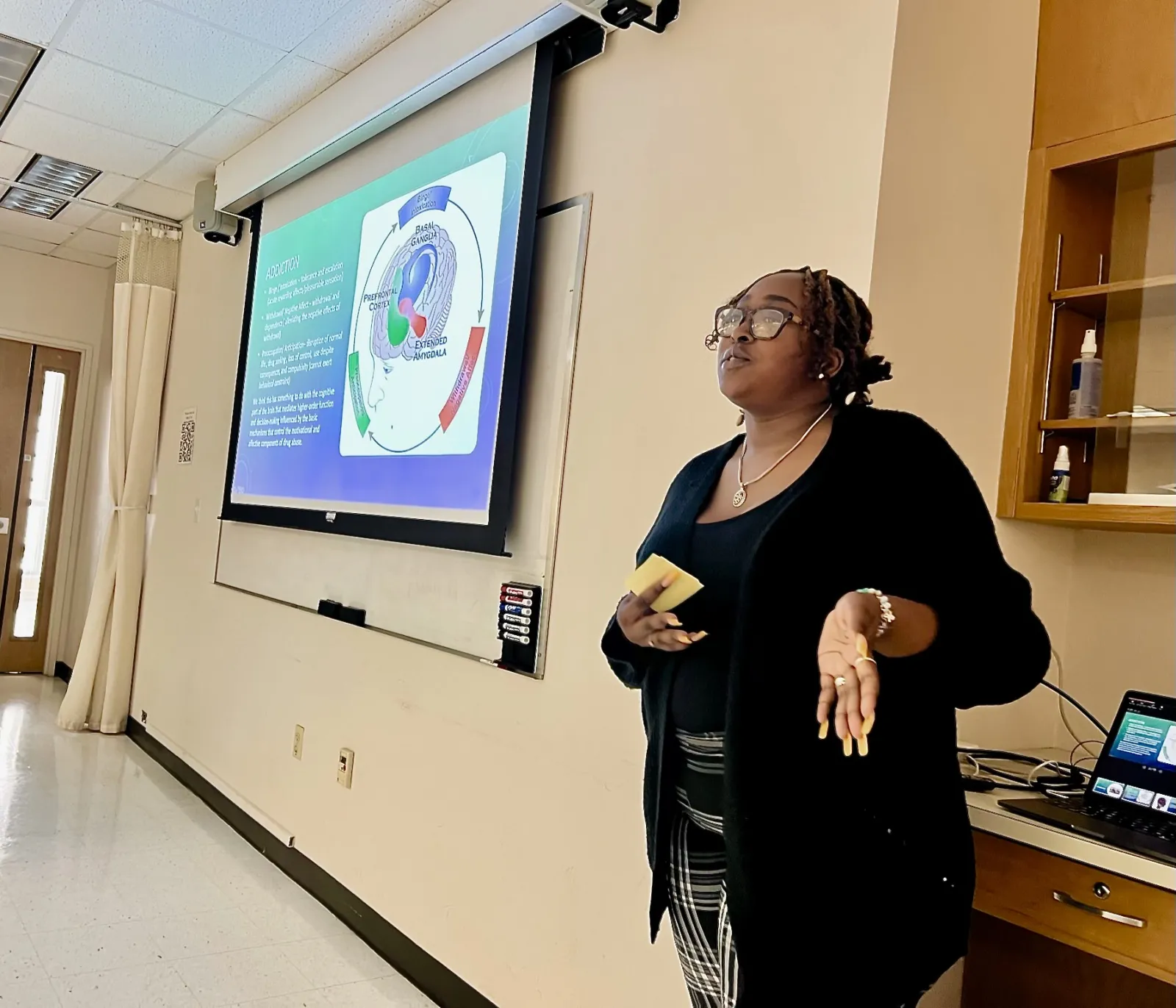 A student presenting their summer research.