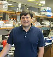 Steven Hutchens standing in lab