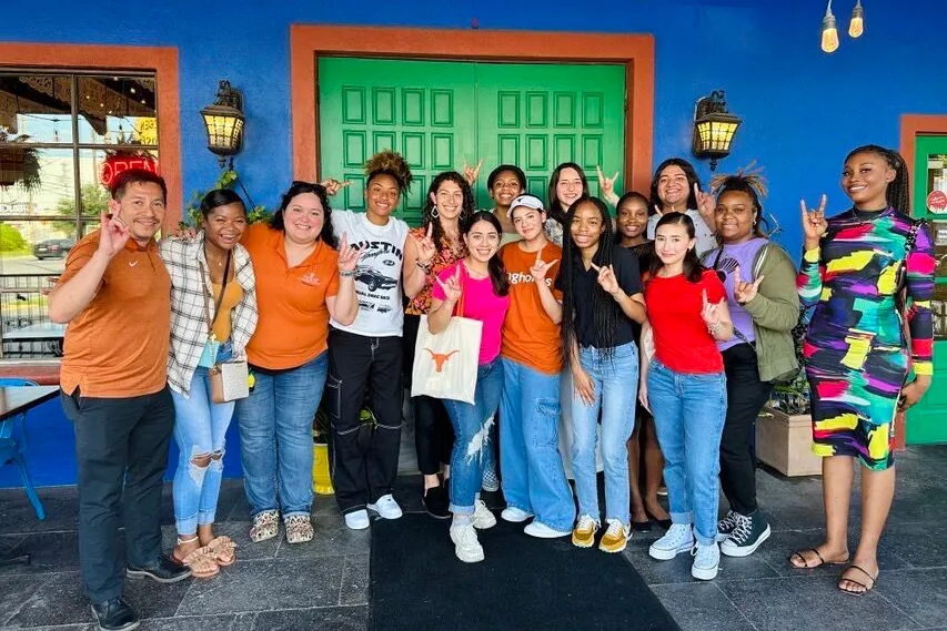 PEPP Camp participants and College of Pharmacy representatives smiling outside of restaurant