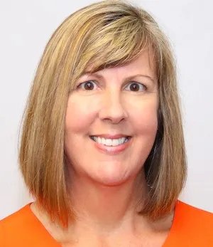 A woman smiling.