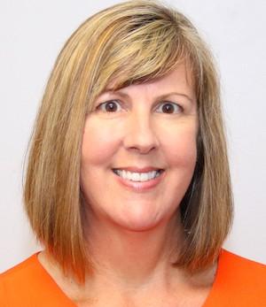 A woman smiling.
