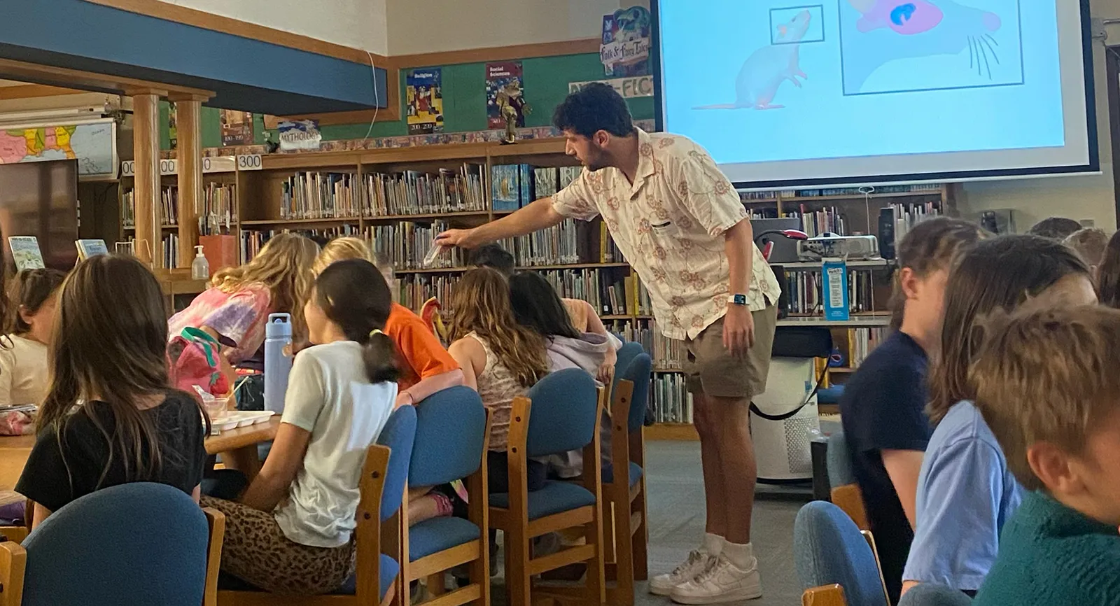 PharmTox graduate student making 'lunch and learn' presentation at Lee Elementary School