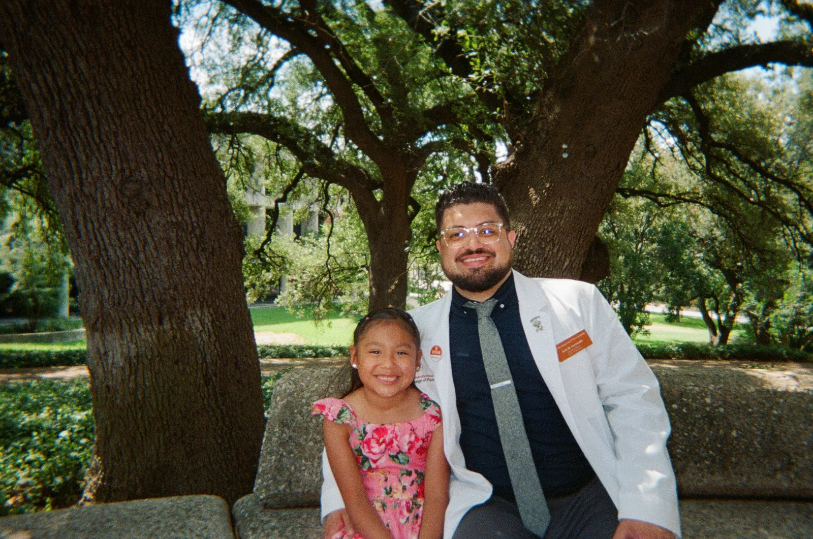 Student pharmacist Erik Coronado posing with a young family member.