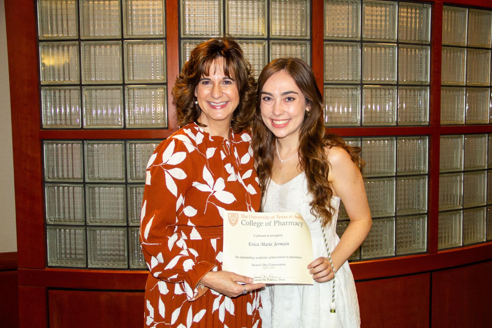 Associate Dean Acosta poses with one of this year’s three Distinguished Scholars, Erica Jermain.