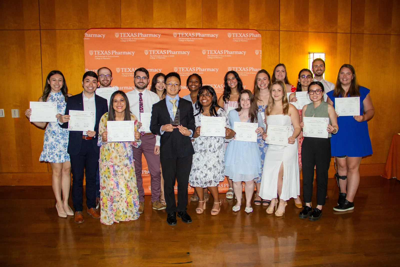 A group of Texas Pharmacy students holding their awards at the Celebration of Excellence event.
