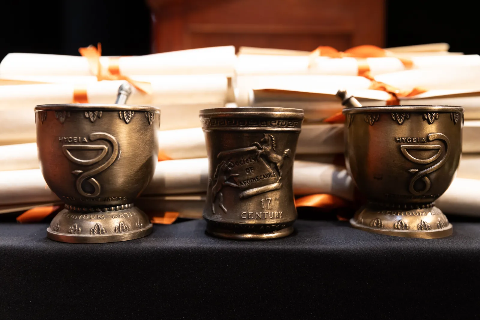Three metal cups.