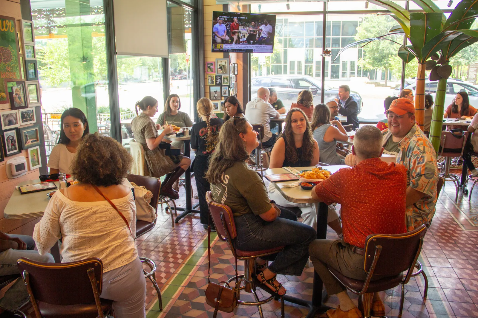 A group shot of Texas Pharmacy staff at a social event in a restaurant.