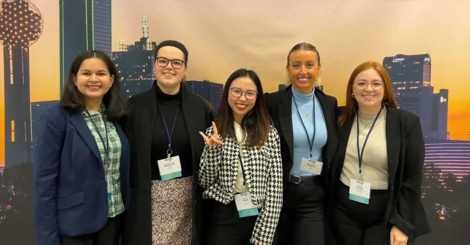 Five female student pharmacists pose together at the ACCP conference.