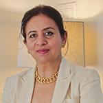 Dr. Simran Tiwana smiling in an indoor setting