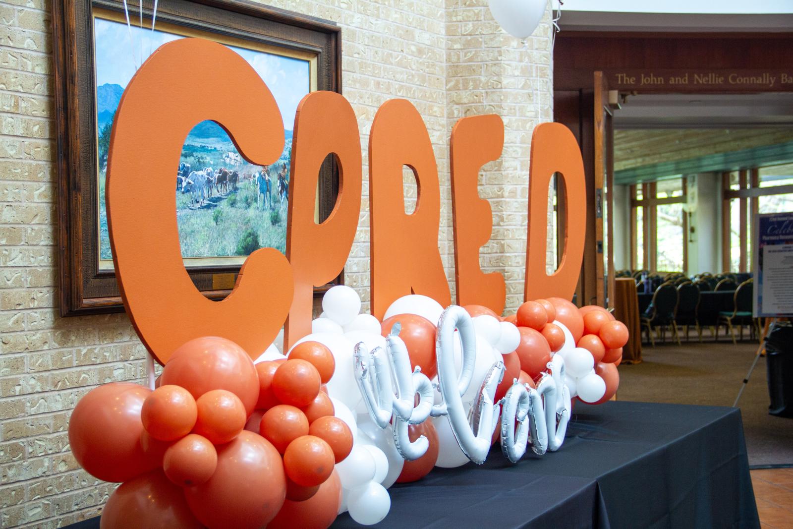 A balloon sign that says "CPRED."