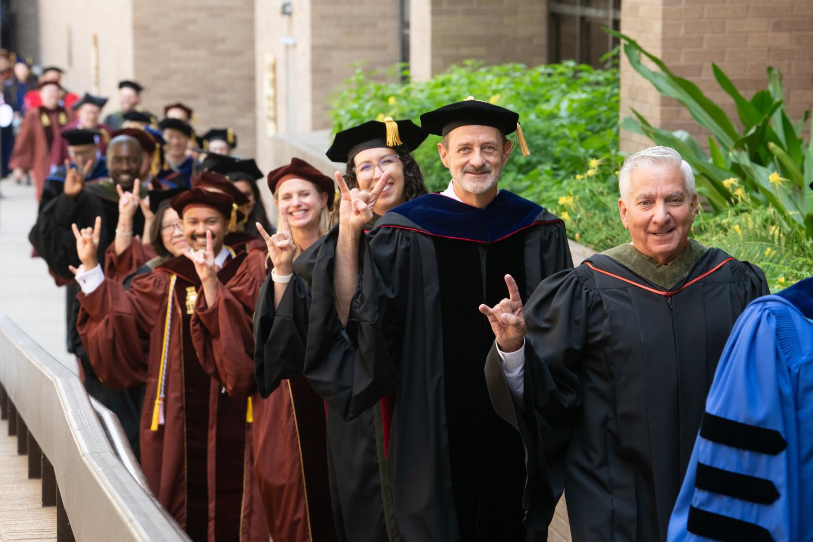 Faculty in a line of the processional at graduation. 