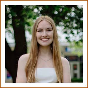 Headshot of pharmacy student Frances. She has long, light hair and is wearing a white strapless dress while smiling brightly to camera.