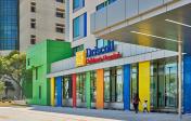 Driscoll Children's Hospital entrance with columns painted with bright, primary colors