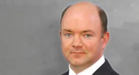 A man wearing a suit and tie.