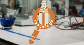 A lab table with an Explore UT logo in the foreground.