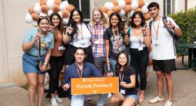 A group of pharmacy students pose together during the Class of 2026 Block party celebration.