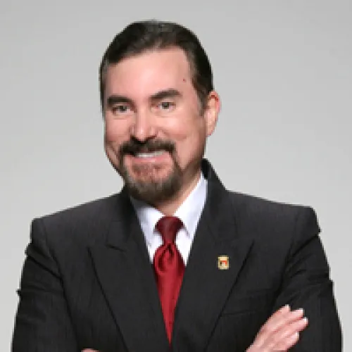 Dr. Francisco Gonzalez-Lima smiling and wearing a suit