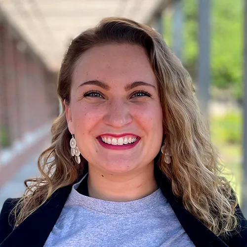 Molly Nichols smiling in an outdoor setting