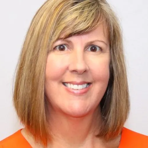 A woman smiling.