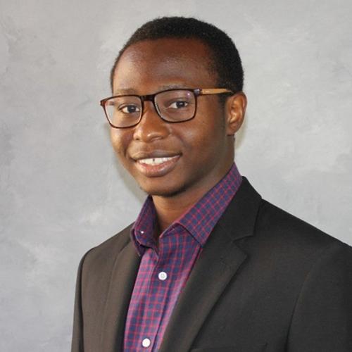 Ayobami Aiyeolemi smiling and wearing a black sports coat